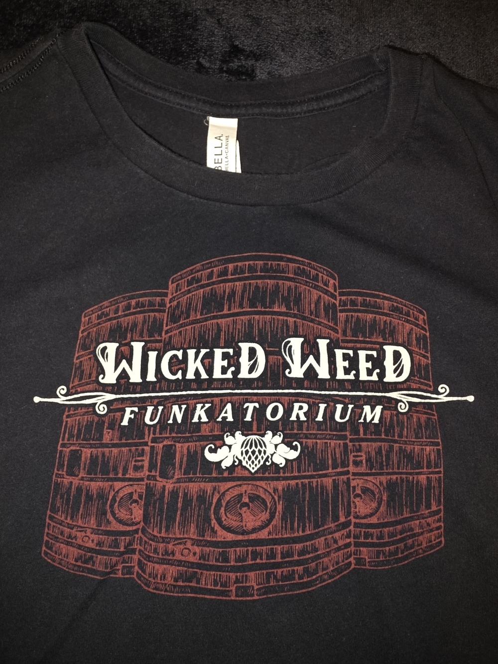 Black Tee with Red Barrel and White Text Graphic